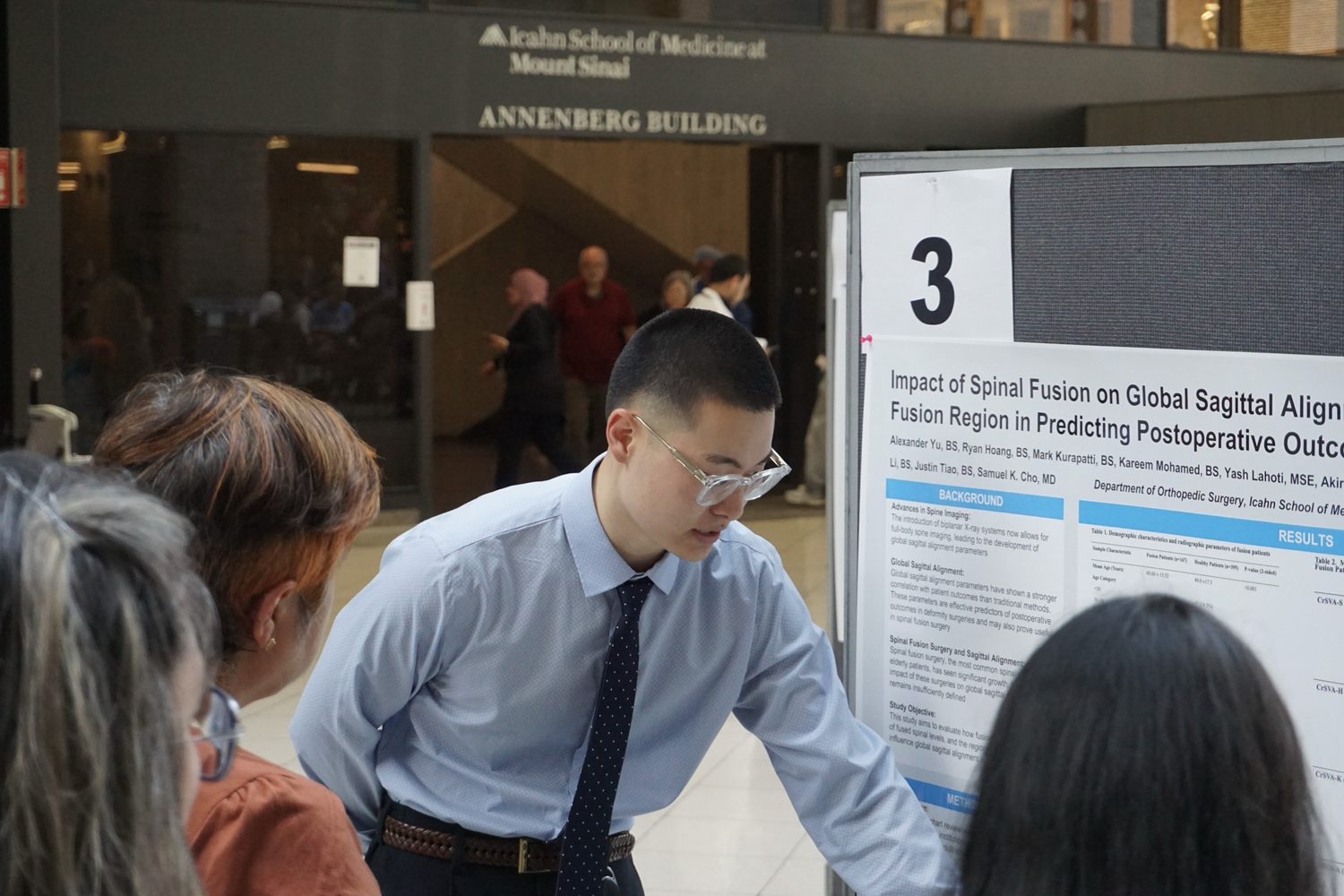 Alexander Yu presenting a research poster at the Icahn School of Medicine at Mount Sinai
